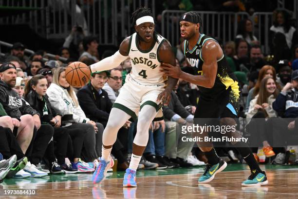 Jrue Holiday of the Boston Celtics posts up against Buddy Hield of the Indiana Pacers during the second quarter at the TD Garden on January 30, 2024...