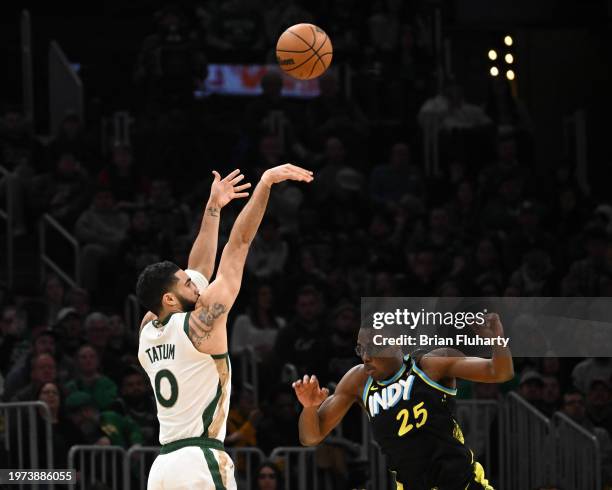 Jayson Tatum of the Boston Celtics attempts a three-point basket against Jalen Smith of the Indiana Pacers during the second quarter at the TD Garden...