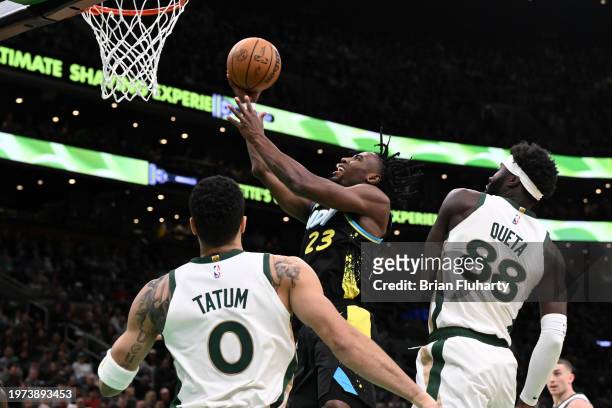 Aaron Nesmith of the Indiana Pacers goes up for a shot against Neemias Queta and Jayson Tatum of the Boston Celtics during the second quarter at the...