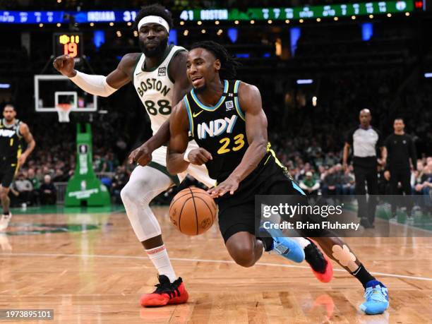 Aaron Nesmith of the Indiana Pacers drives to the basket against Neemias Queta of the Boston Celtics during the second quarter at the TD Garden on...