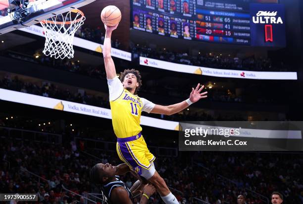 Jaxson Hayes of the Los Angeles Lakers is charged with an offensive foul as he attempts to dunk over Clint Capela of the Atlanta Hawks during the...