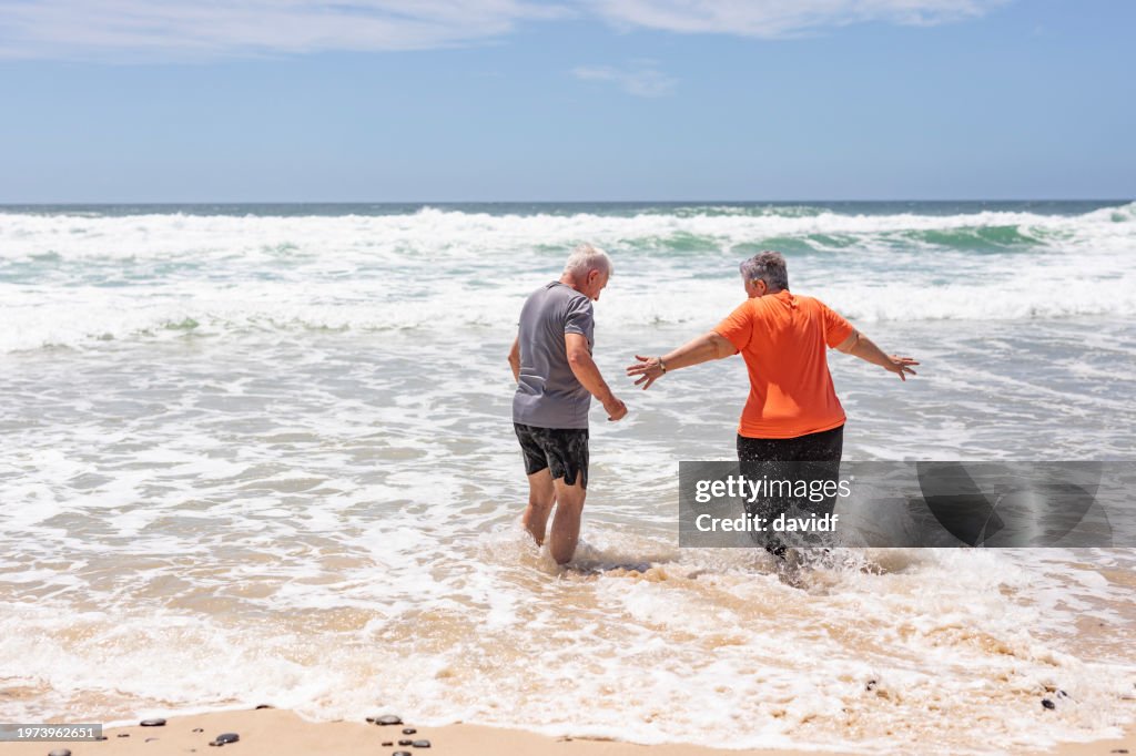 Active Senior Couple at the Beach in Summer