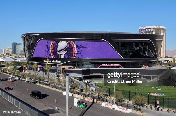 An exterior view shows an image of the Lombardi Trophy and signage for Super Bowl LVIII at Allegiant Stadium on January 30, 2024 in Las Vegas,...