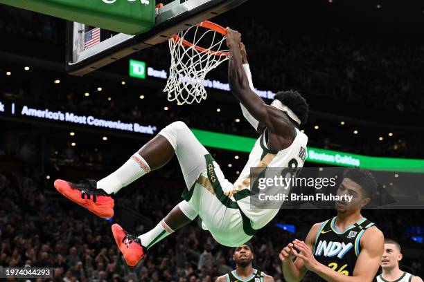 Neemias Queta of the Boston Celtics dunks ovr Ben Sheppard of the Indiana Pacers during the fourth quarter at the TD Garden on January 30, 2024 in...