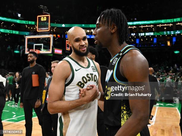 Derrick White of the Boston Celtics talks with Aaron Nesmith of the Indiana Pacers after the game at the TD Garden on January 30, 2024 in Boston,...