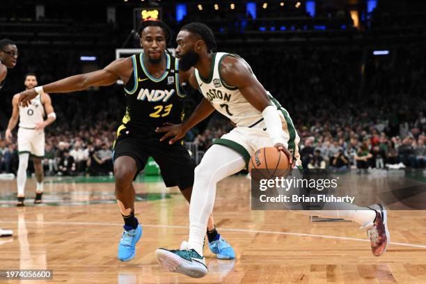 Jaylen Brown of the Boston Celtics drives to the basket against Aaron Nesmith of the Indiana Pacers during the fourth quarter at the TD Garden on...