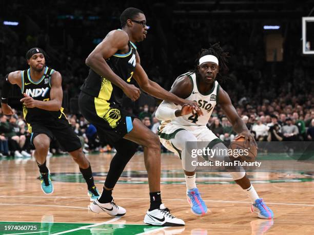 Jrue Holiday of the Boston Celtics dribbles the ball against Jalen Smith of the Indiana Pacers during the fourth quarter at the TD Garden on January...