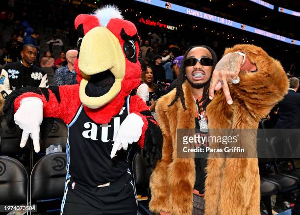 Harry the Hawk and Quavo attend the game between Los Angeles Lakers and the Atlanta Hawks at State Farm Arena on January 30, 2024 in Atlanta,...