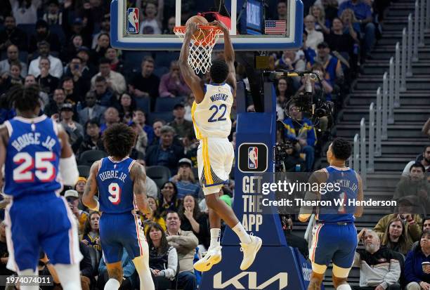 Andrew Wiggins of the Golden State Warriors slam dunks against the Philadelphia 76ers during the first quarter at Chase Center on January 30, 2024 in...