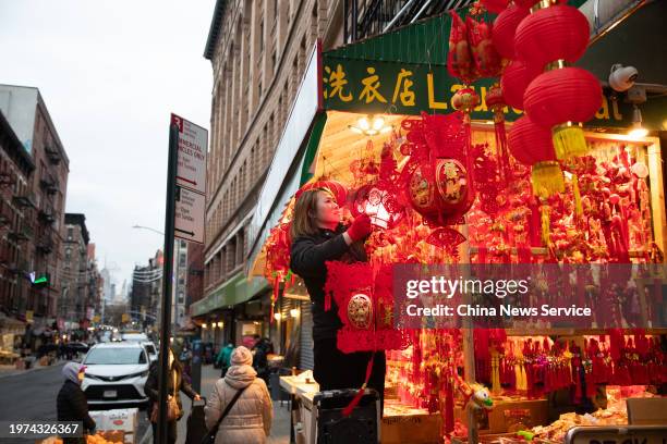 Staff arranges Spring Festival decorations at Chinatown on January 30, 2024 in New York City. The Spring Festival, or the Chinese Lunar New Year,...