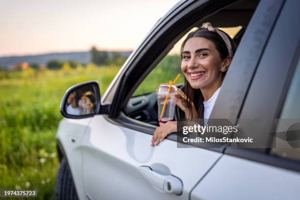young woman on the road trip - wonderlust stock-fotos und bilder