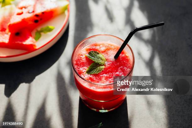 fresh drink with watermelon and mint on dark concrete table. summer lemonade, healthy mocktail. - fruktkött bildbanksfoton och bilder