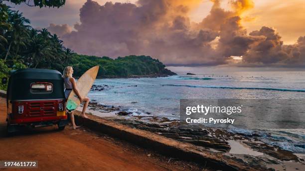 surfing in sri lanka, hiriketiya. - sri lanka woman stock pictures, royalty-free photos & images