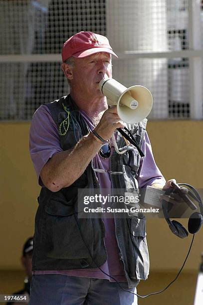 Director Tony Scott talks to cast and crew while filming a scene of "Man On Fire" at a sports club May 5, 2003 in Mexico City, Mexico.