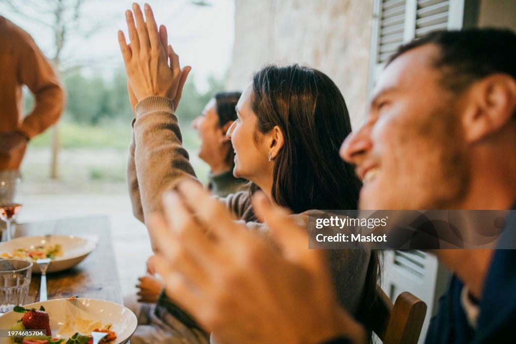 Freinds Clapping Happy Friends Clapping During Dinner Party At Patio High-Res Stock ...