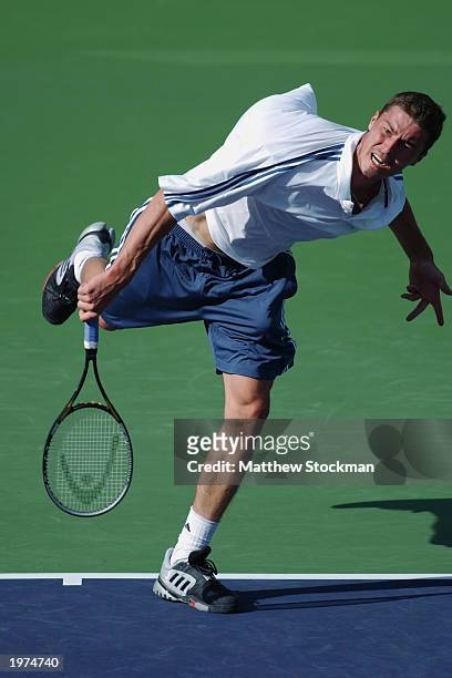 Marat Safin of Russia serves to Robby Ginepri during the Pacific Life Open at the Indian Wells Tennis Garden on March 13, 2003 in Indian Wells,...
