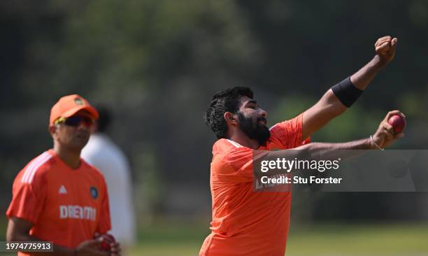 India bowler Jasprit Bumrah in bowling action watched by coach Rahul Dravid during India nets ahead of the 2nd Test Match at ACA-VDCA Stadium on...