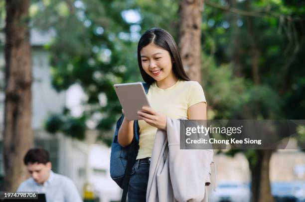 portrait of asian beautiful female university student. - tuition stock pictures, royalty-free photos & images