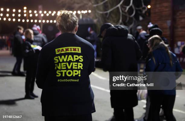 Panini Premier League 2024 sticker albums are handed out outside the stadium ahead of the Premier League match between Aston Villa and Newcastle...