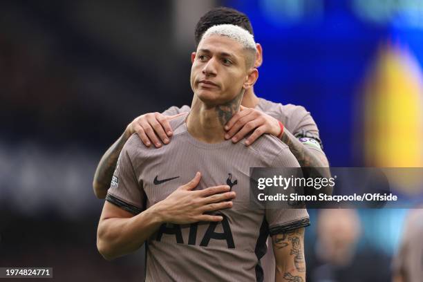 Richarlison of Tottenham Hotspur apologies to the home fans after scoring his side's 1st goal during the Premier League match between Everton FC and...