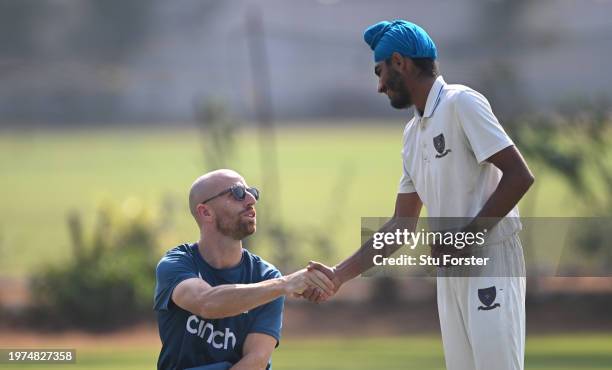 England playerJack Leach shakes hands with a net bowler during England practice ahead of the 2nd Test Match at ACA-VDCA Stadium on January 31, 2024...