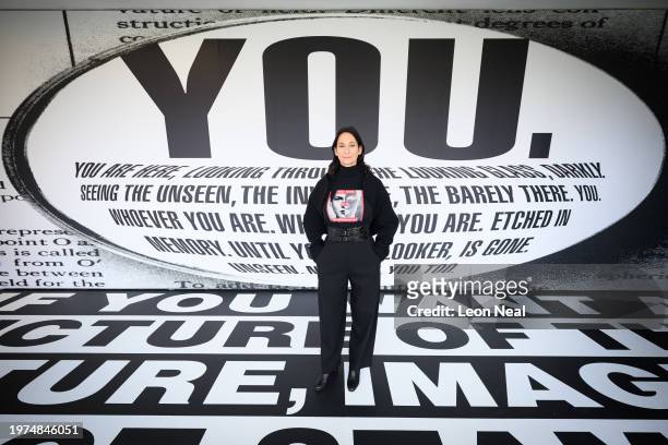 Serpentine CEO Bettina Korek poses for photographs against "Untitled " by Barbara Kruger at the Serpentine South Gallery on January 31, 2024 in...