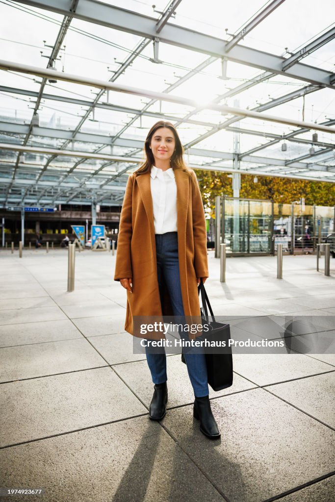 A Confident And Well Dressed Woman At The Aiport