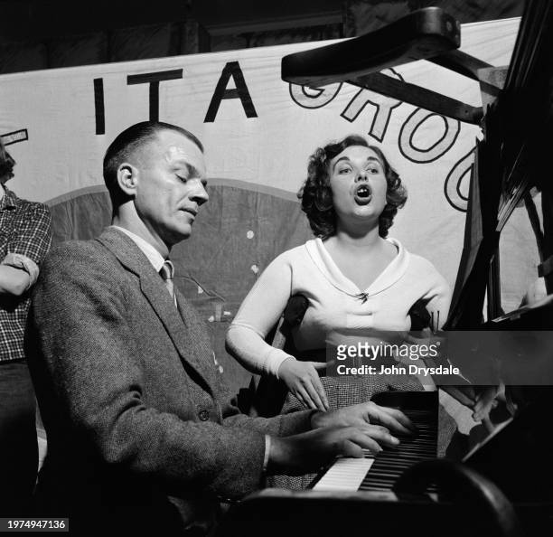 Pianist Alex Alexander accompanies singer Eileen Kiggins during a performing by the the jazz band formed by members of the Kennington Oval branch of...