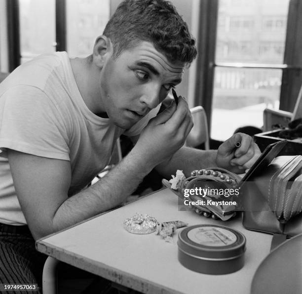 American student Norman Talley backstage as he applied stage make-up for his role as Nick Bottom in a touring production of 'A Midsummer Night’s...