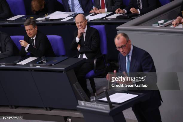 Friedrich Merz, head of the opposition German Christian Democrats , speaks during debates about the 2024 federal budget at the Bundestag as...
