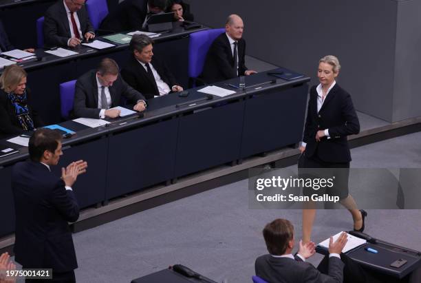 Alice Weidel , co-leader of the far-right Alternative for Germany political party, walks past Interior Minister Nancy Faeser, Finance Minister...