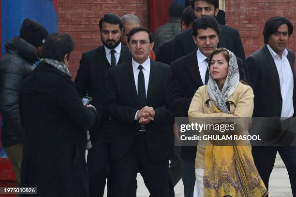 Gohar Ali Khan , lawyer of Pakistan's former Prime Minister Imran Khan, leaves with his leagal team after a court verdict, outside the Adiala Jail in...