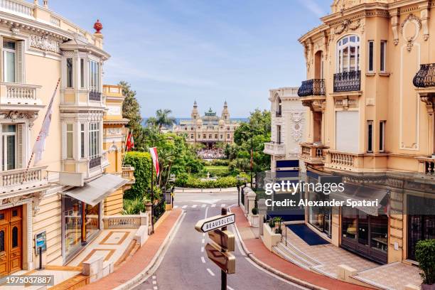 street in monte carlo with historic buildings and grand casino, monaco - monte carlo casino square photos et images de collection