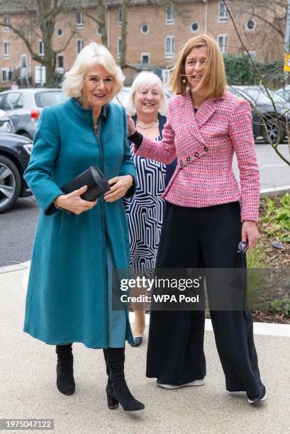 Queen Camilla arrives with Dame Laura Lee, Maggie's Chief Executive, during her visit to Maggie's new cancer support center to hear how Maggie's...