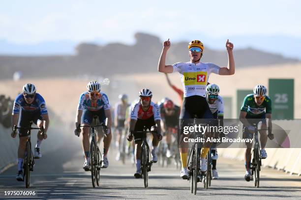 General view of Soren Waerenskjold of Norway and Uno-X Mobility Team - White best young jersey celebrates at finish line as stage winner ahead of...