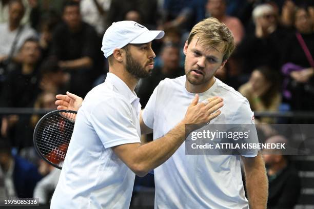 Germany's Kevin Krawietz and Germany's Tim Puetz celebrate their victory over Hungary's Fabian Marozsan and Mate Valkusz during the Davis Cup...