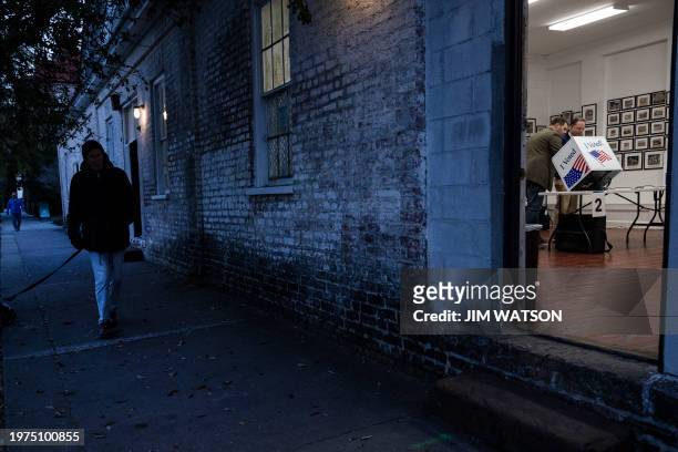 Poll managers set up voting machines as voters begin to arrive at a polling location in Charleston, South Carolina, on February 3 during the South...