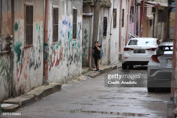 Child, carrying his school bag, gestures near narrow street al-Am'ari Refugee Camp after funding cuts to UNRWA in Ramallah, West Bank on February 03,...
