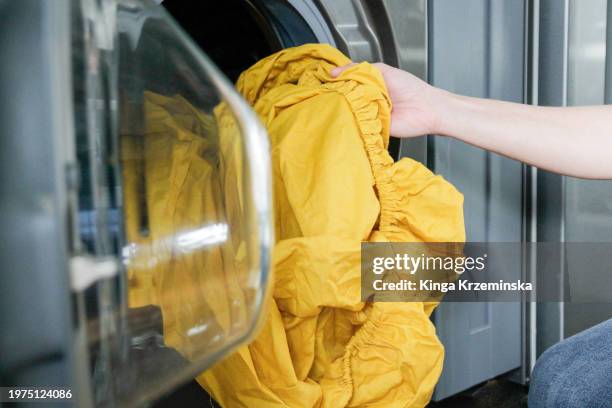 washing bedsheets - sleep hygiene stock pictures, royalty-free photos & images