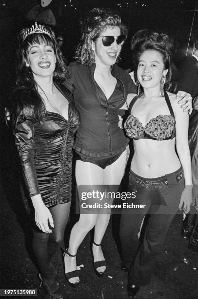 Portrait of nightclub promotor and 'Club Kid' Susan Anton , with unidentified others, at the Roxy nightclub, New York, New York, March 31, 1990.