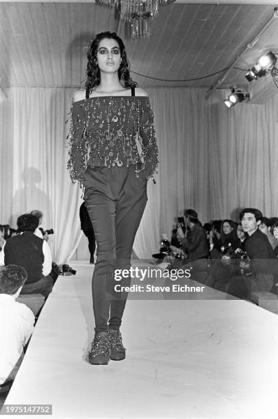 View of an unidentified model on a runway at a Dolce & Gabbana show for New York Fashion Week at the Puck building, New York, New York, April 2, 1990.