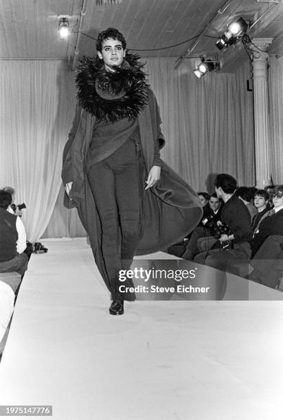 View of an unidentified model on a runway at a Dolce & Gabbana show for New York Fashion Week at the Puck building, New York, New York, April 2, 1990.