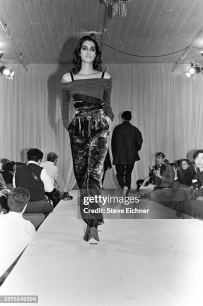 View of an unidentified model on a runway at a Dolce & Gabbana show for New York Fashion Week at the Puck building, New York, New York, April 2, 1990.