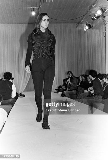 View of an unidentified model on a runway at a Dolce & Gabbana show for New York Fashion Week at the Puck building, New York, New York, April 2, 1990.