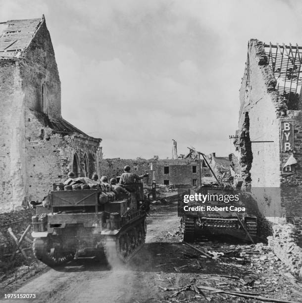 American troops aboard a M7 Priest 105 mm Howitzer Motor Carriage self propelled gun from the 2nd Armored Division of VII Corps, United States First...