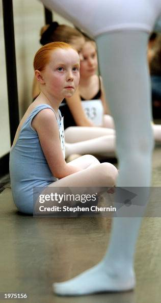 Arden Rafferty Arden Pickoff-Rafferty watches another child stretch during tryouts ...