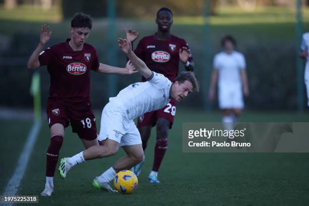 Sergio Perciun of Torino U19 competes for the ball with Luca Napolitano of SS Lazio U19 during the Coppa Italia Primavera match between SS Lazio U19...