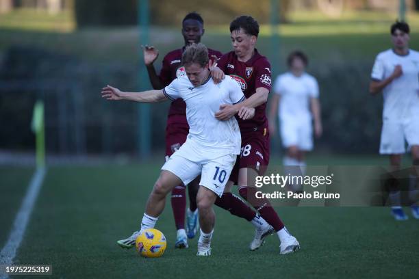 Sergio Perciun of Torino U19 competes for the ball with Luca Napolitano of SS Lazio U19 during the Coppa Italia Primavera match between SS Lazio U19...