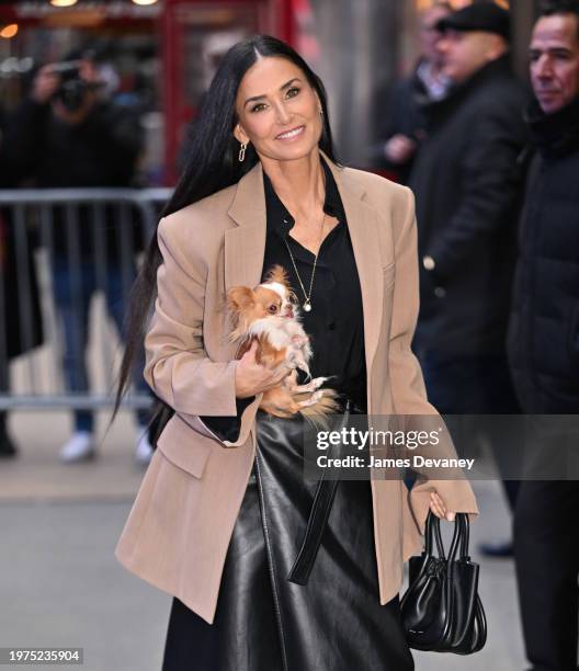 Demi Moore and dog, Pilaf arrive at ABC's "Good Morning America" in Times Square on January 31, 2024 in New York City.
