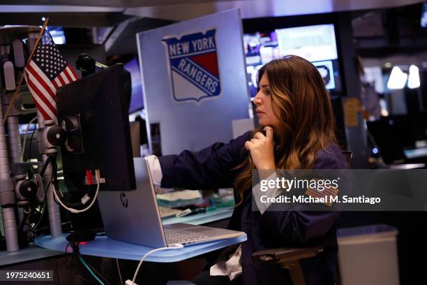 Traders work on the floor of the New York Stock Exchange during morning trading on January 31, 2024 in New York City. Stocks opened up mixed with the...